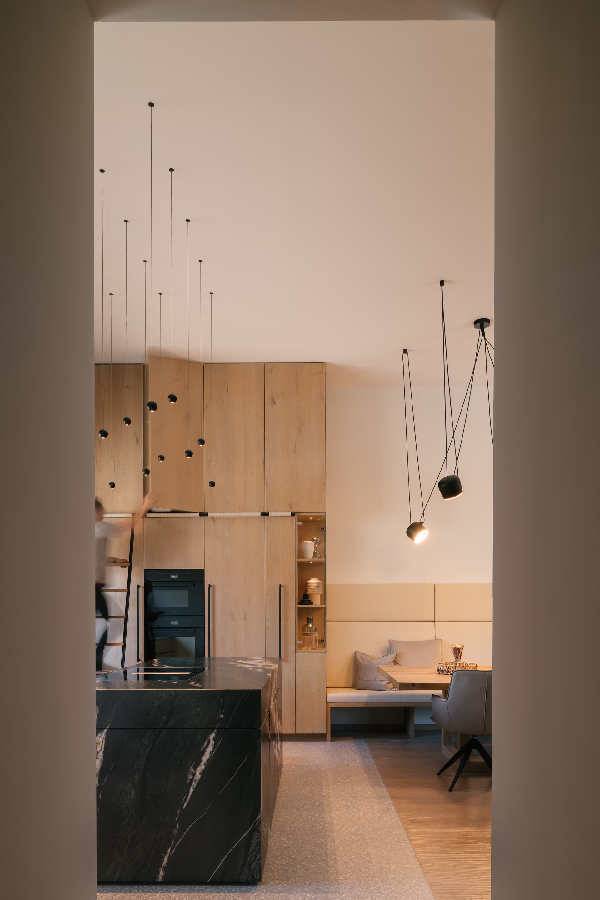 Living space with modern furnishing and custom woodwork.